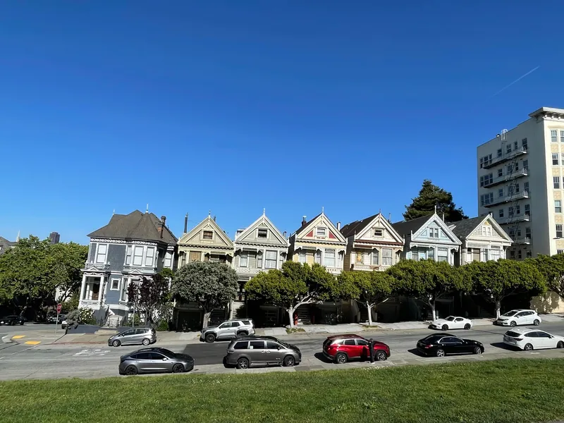 A vibrant view of the famous Painted Ladies houses in San Francisco's Alamo Square.