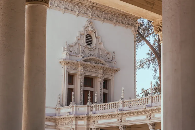 Close-up of decorative Spanish Revival facade in San Diego, showcasing intricate architectural details.