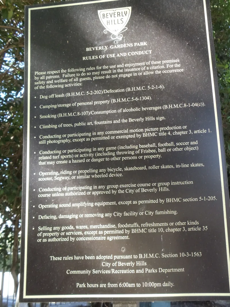 Rules of Use and Conduct sign of Beverly Gardens Park in Beverly Hills, California