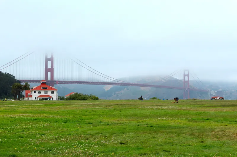Scenic view of the Golden Gate Bridge partially shrouded in fog in San Francisco.