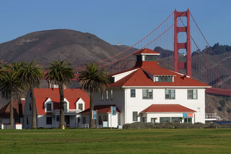Old Crissy Field Coast Guard Station with Golden Gate Bridge in the background.