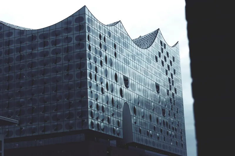 Striking modern architecture of Elbphilharmonie in Hamburg, Germany, captured with a monochrome tone.