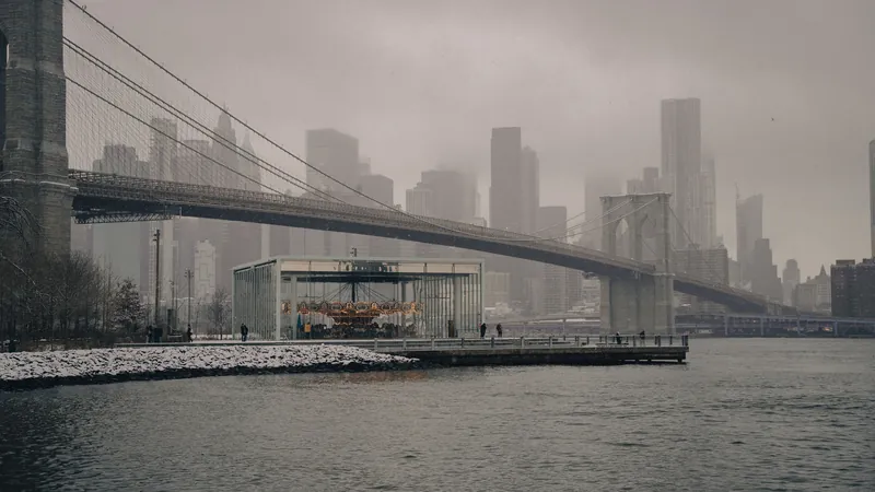 Winter view of the Brooklyn Bridge with Manhattan skyline in New York City.
