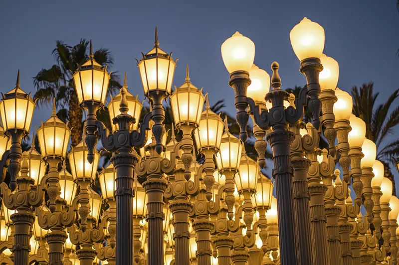 View of the iconic Urban Light installation in Los Angeles at twilight.
