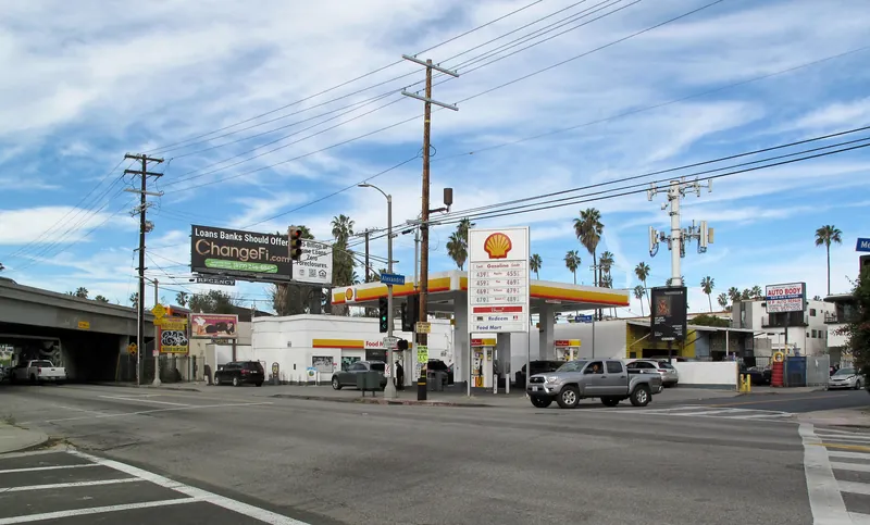 Intersection of Melrose Avenue and Alexandria, East Hollywood, Los Angeles. the 101 Freeway crosses Melrose at left. Inflation has pushed gas prices to an all-time high.