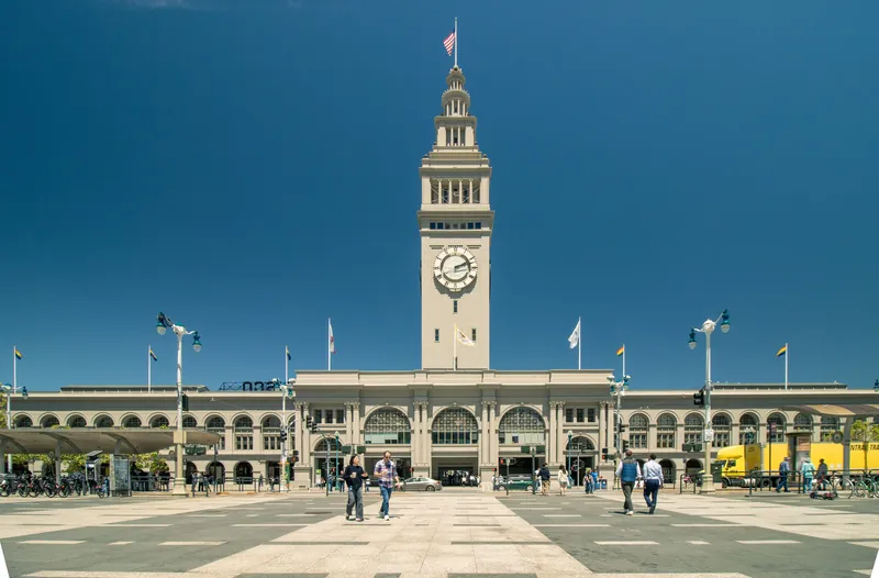 View of the iconic Ferry Building in San Francisco with a clear blue sky.