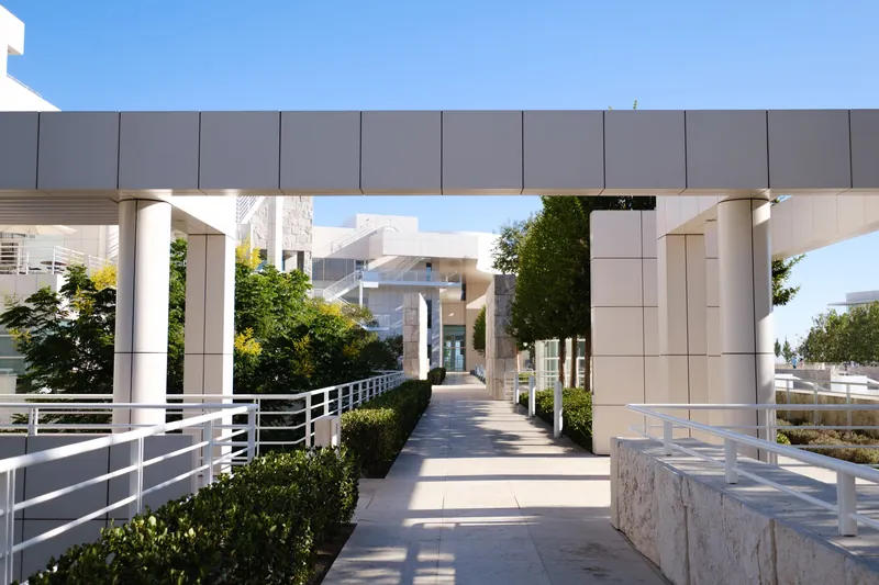 A scenic view of the modern architecture at the Getty Center plaza with lush greenery.