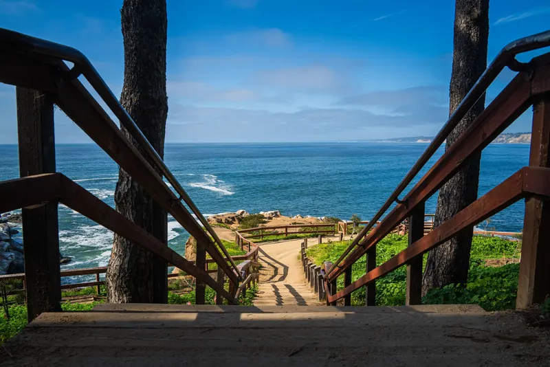 Wooden stairs leading to a stunning ocean view in La Jolla, San Diego, CA.